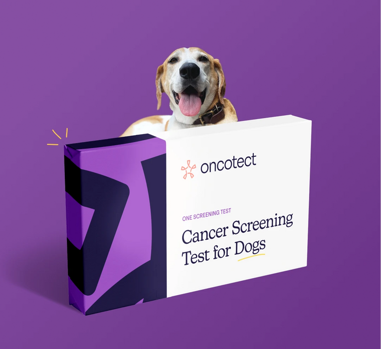 A smiling dog sitting behind an Oncotect cancer screening test packaging